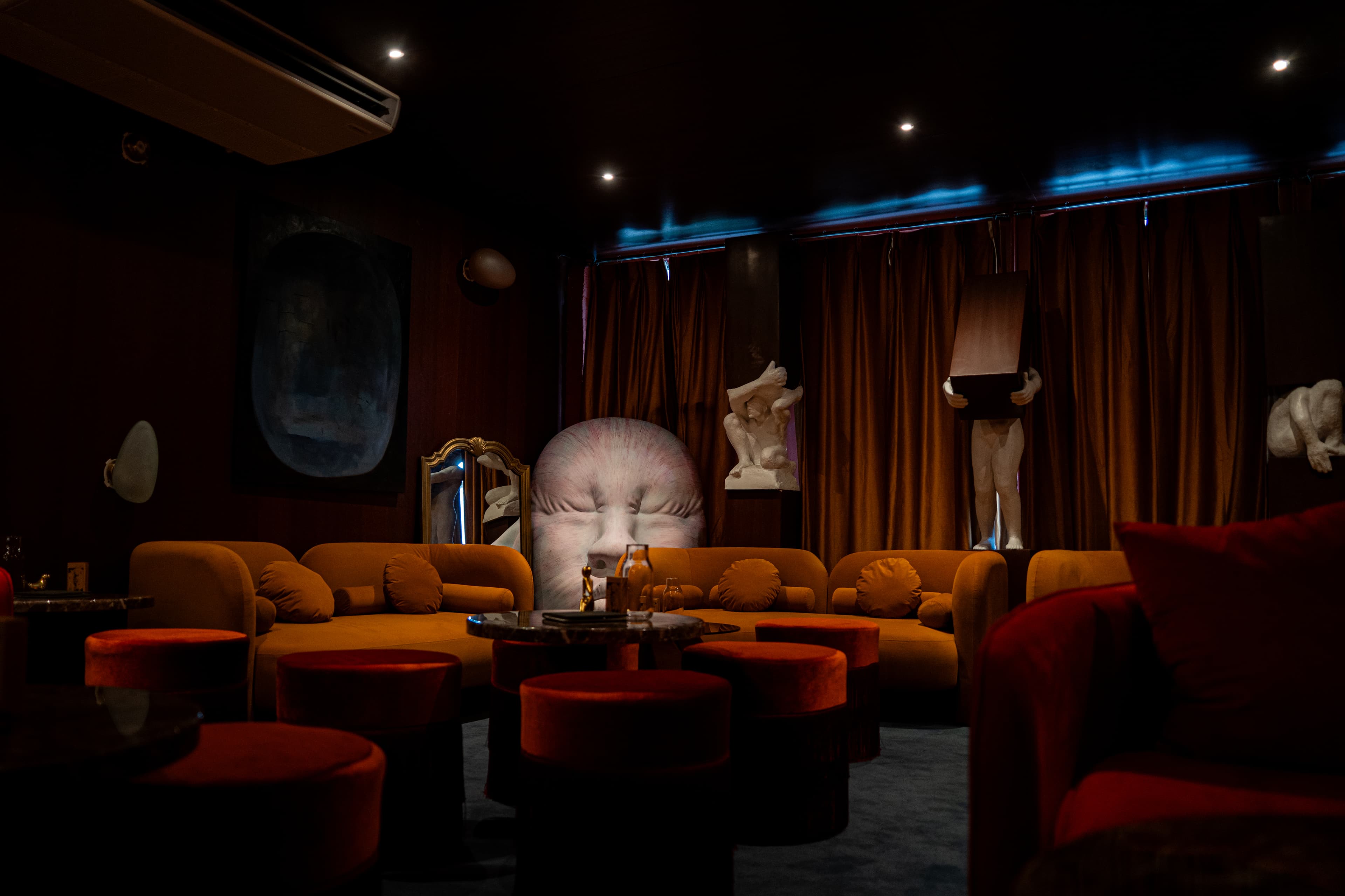 Face sculpture and lounge seating at RokuNana, Lower East Side, NYC